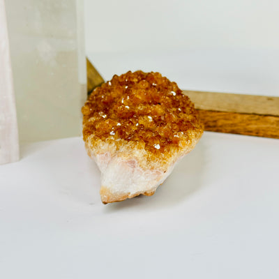 citrine cluster with decorations in the background