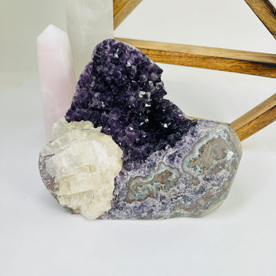 amethyst cut base with decorations in the background