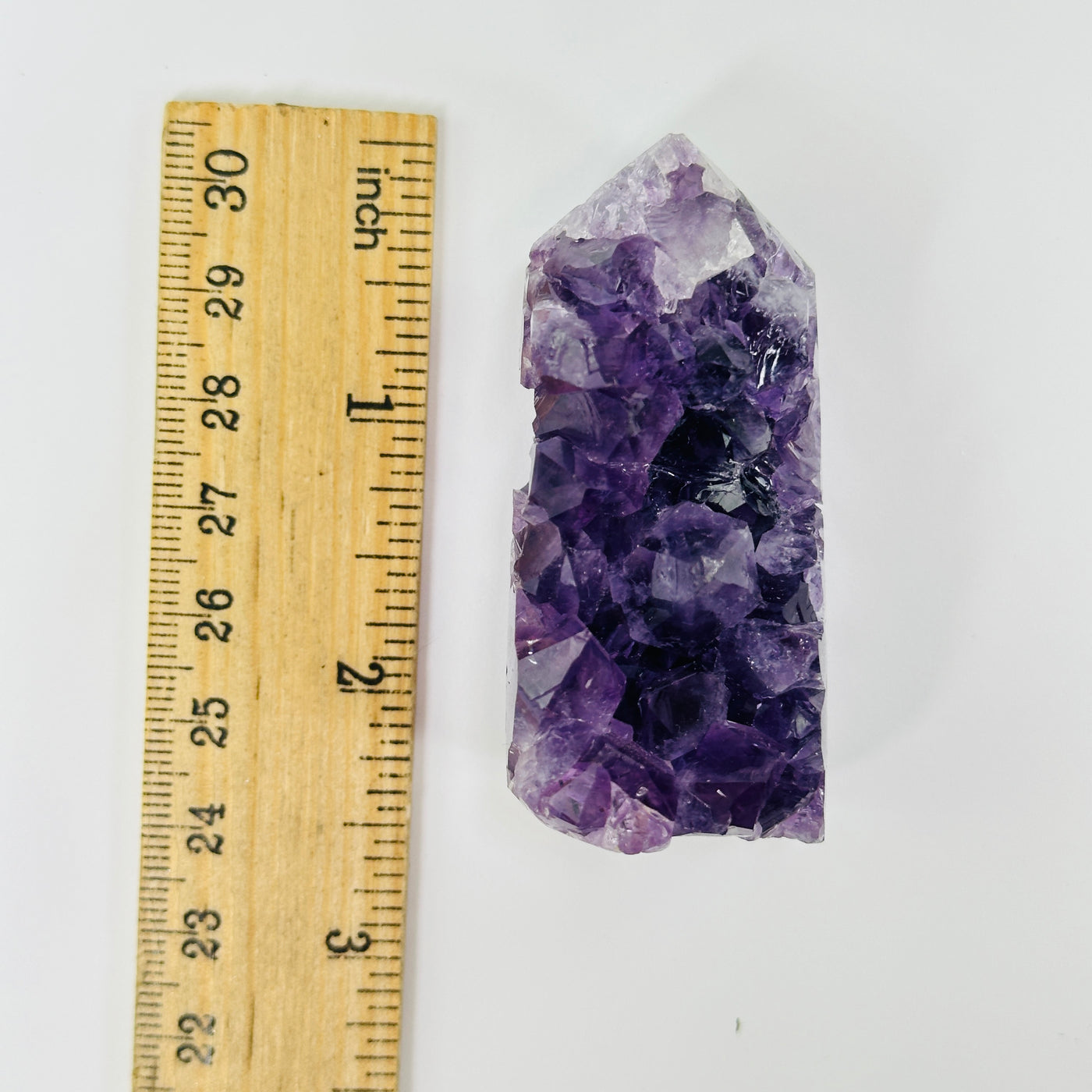 AMETHYST point with decorations in the background