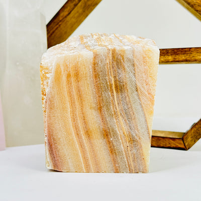 calcite cut base with decorations in the background