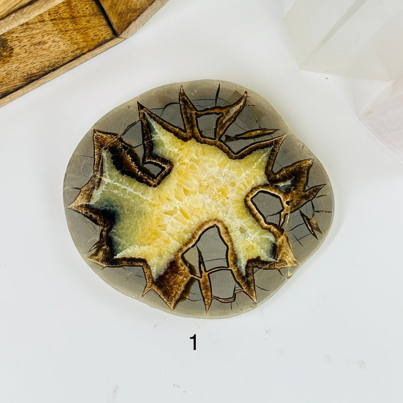 Septarian platter with decorations in the background
