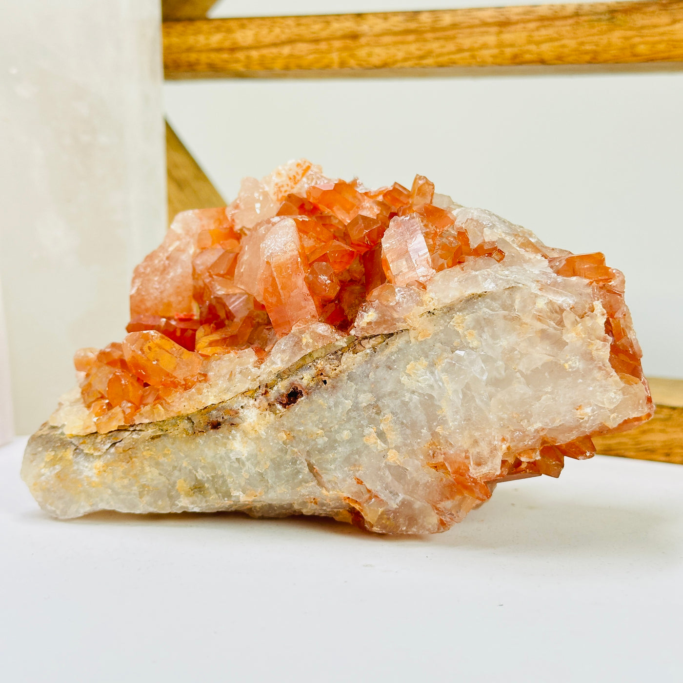 tangerine quartz with decorations in the background