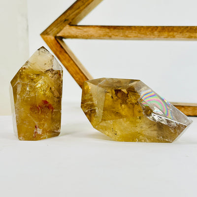 citrine points with decorations in the background
