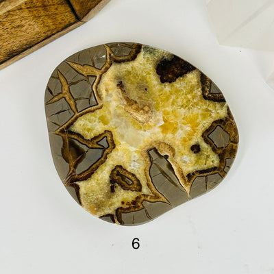 Septarian platter with decorations in the background 