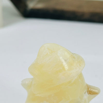 CALCITE GHOST WITH DECORATIONS IN THE BACKGROUND