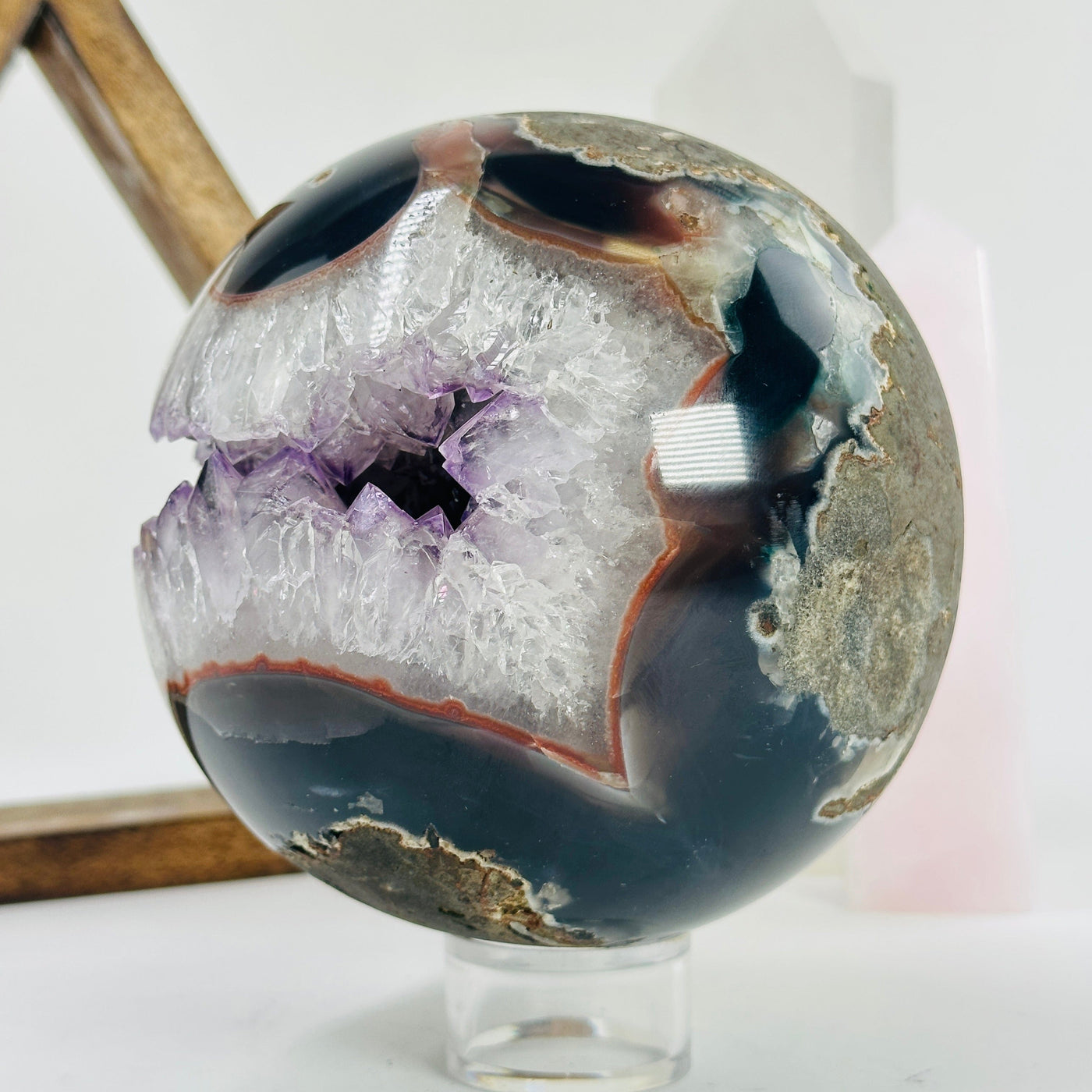 amethyst sphere with decorations in the background