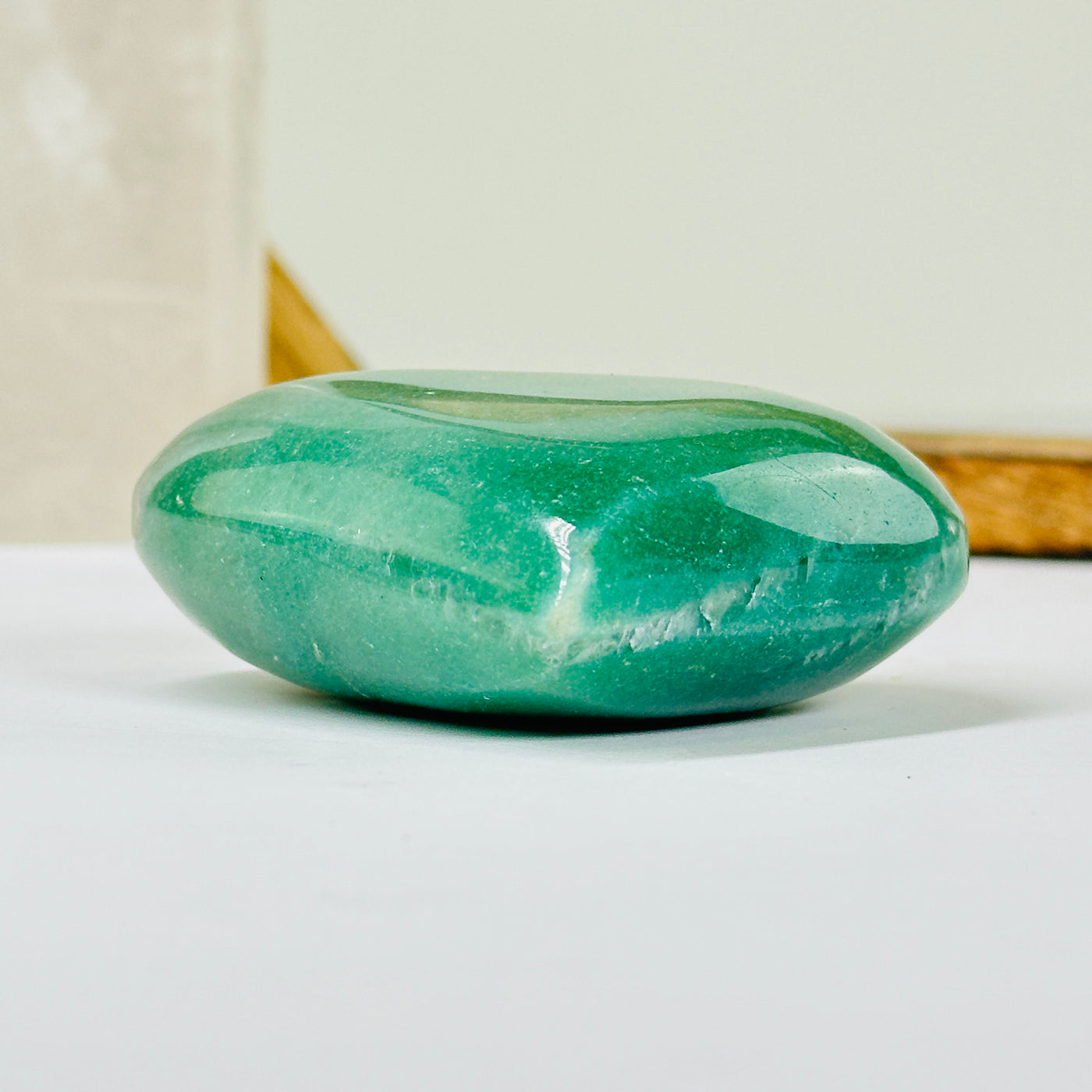 aventurine heart with decorations in  the background