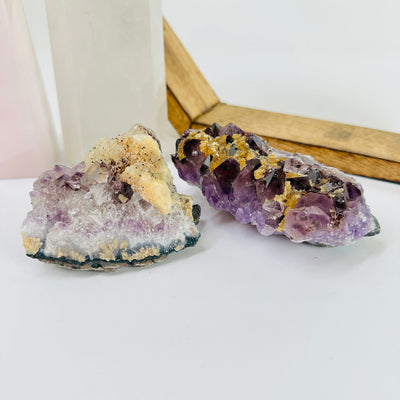  AMETHYST CLUSTER with decorations in the background