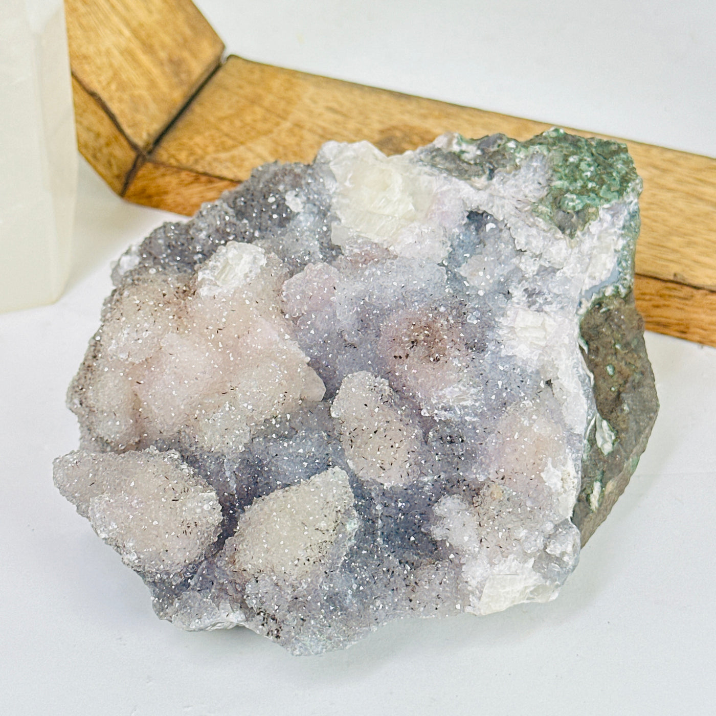 amethyst cluster with decorations in the background