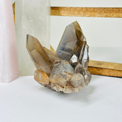 smokey quartz with decorations in  the background