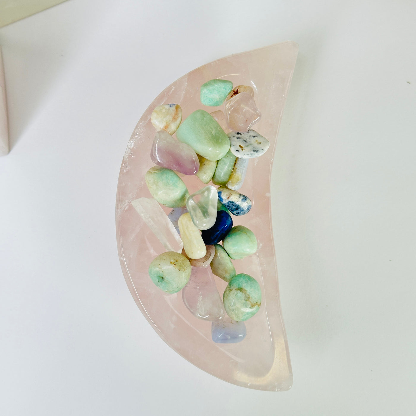 rose quartz bowl with decorations in the background