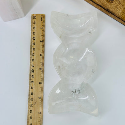 crystal quartz moon phase bowl next to a ruler for size reference