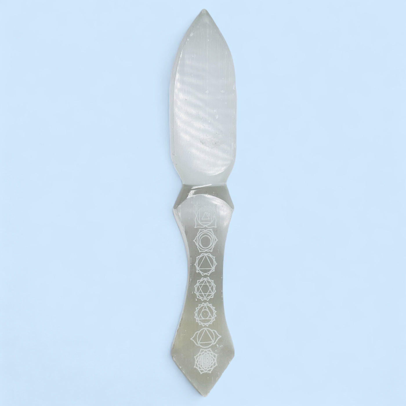  Etched Selenite Crystal Knife front view with a blue background.