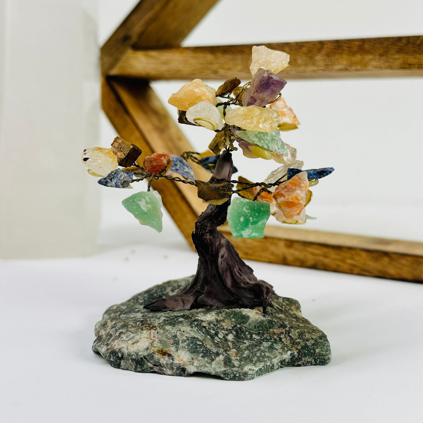 mixed stone on aventurine base with decorations in the background