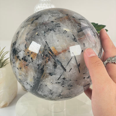 Black Tourmalinated Quartz Crystal Sphere - One-of-a-Kind in hand for size reference