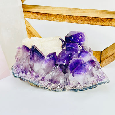 amethyst cut base with decorations in the background