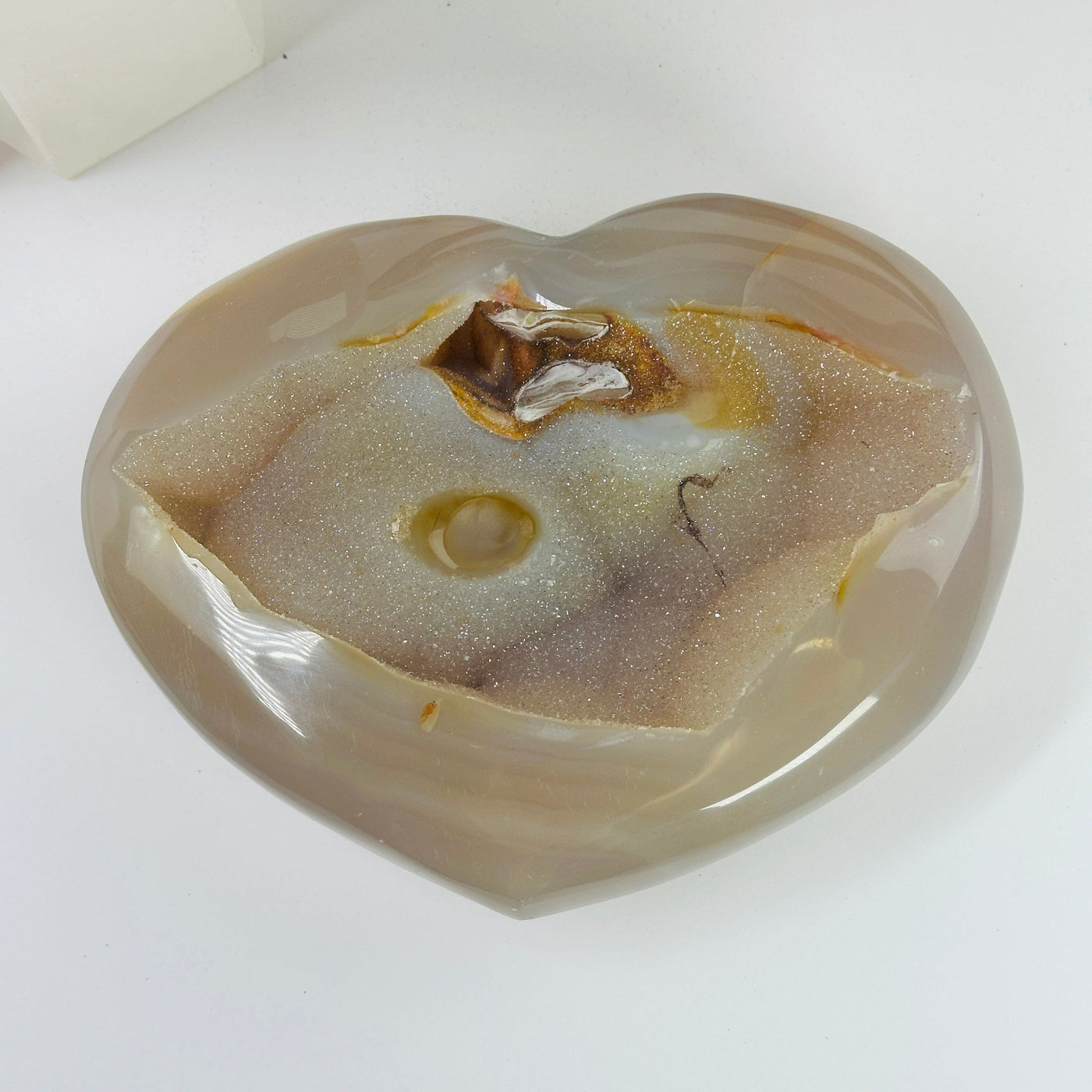 agate heart with decorations in the background