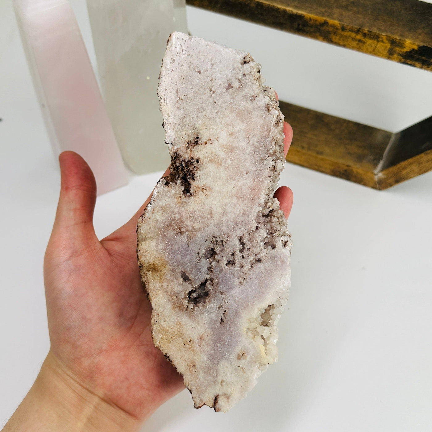 pink amethyst slab with decorations in the background