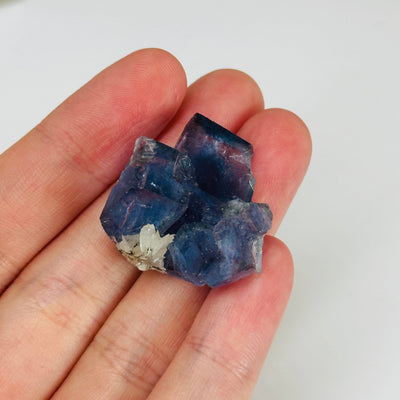 blue fluorite with decorations in the background