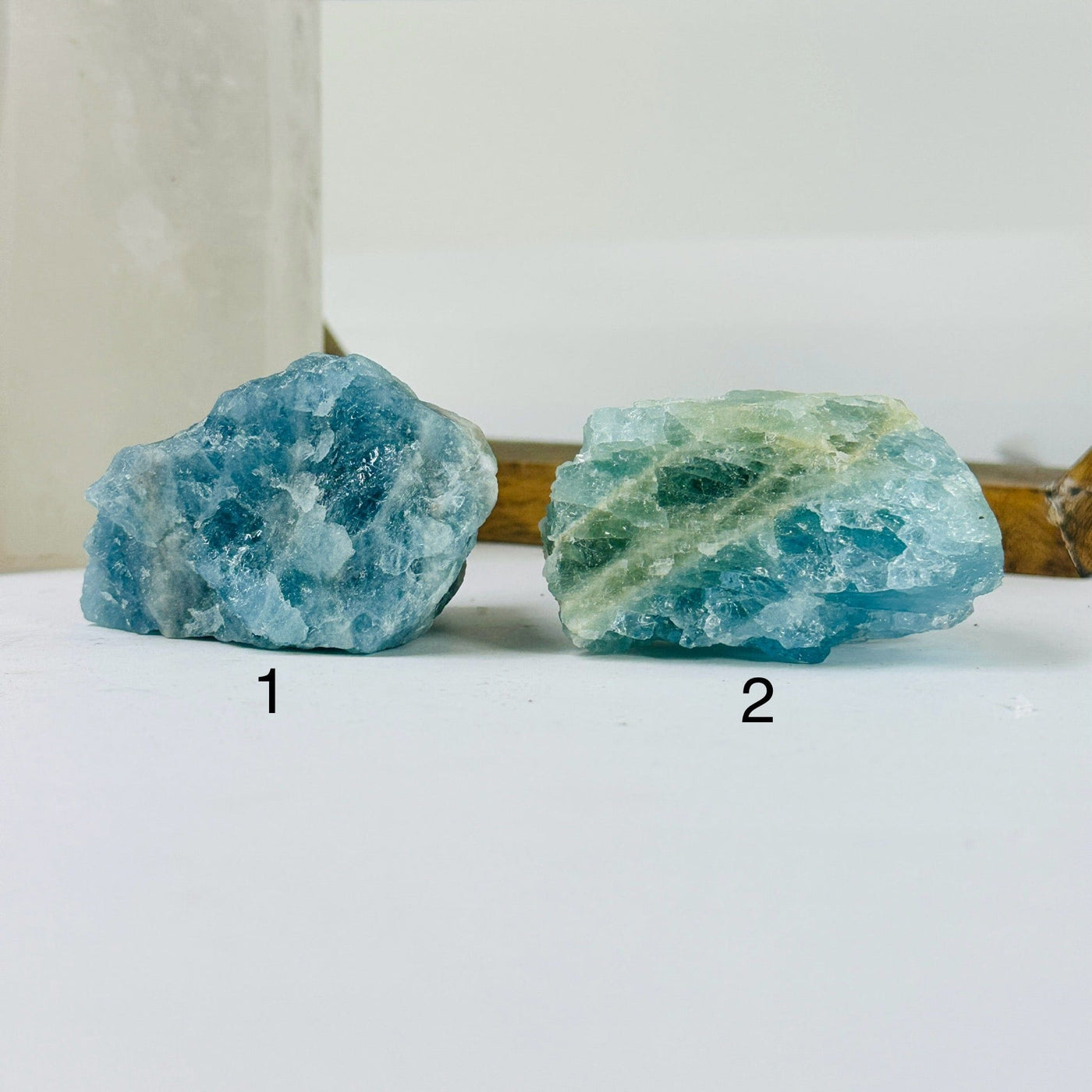 aquamarine stone with decorations in the background