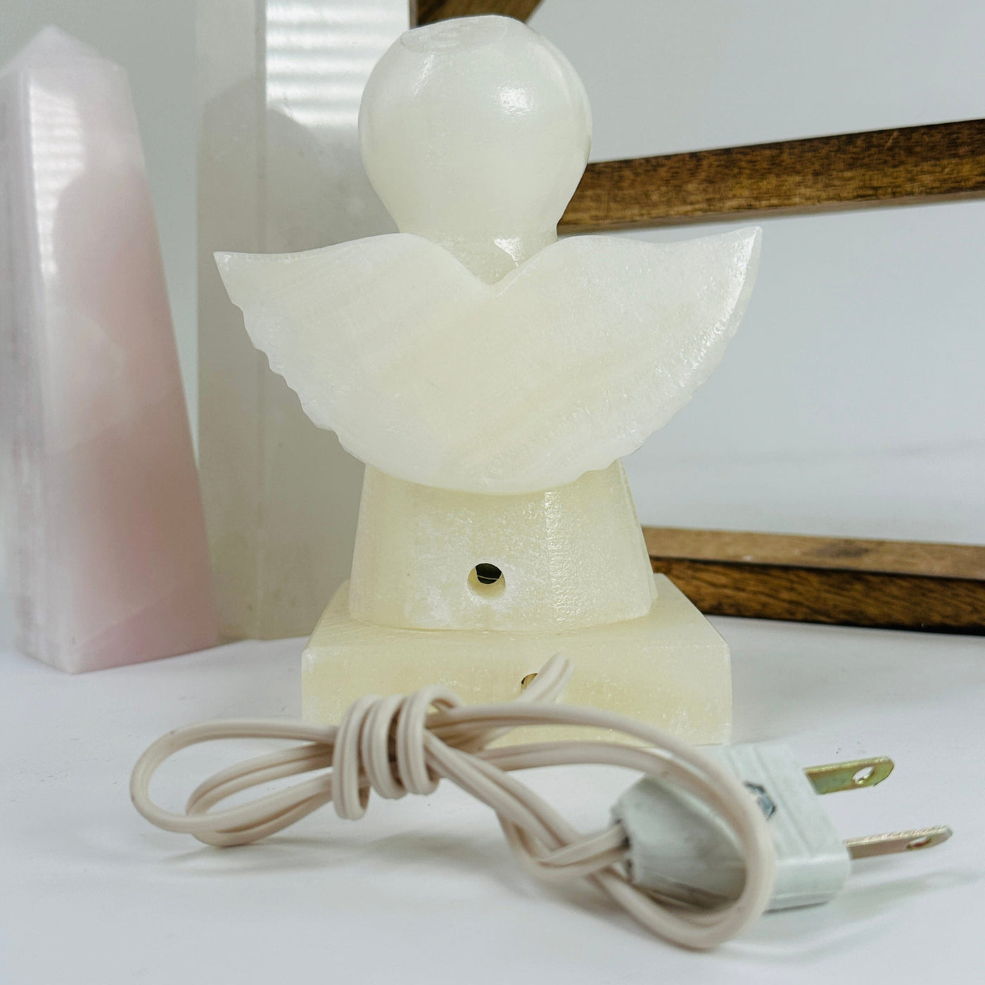 onyx angel lamp with decorations in the background