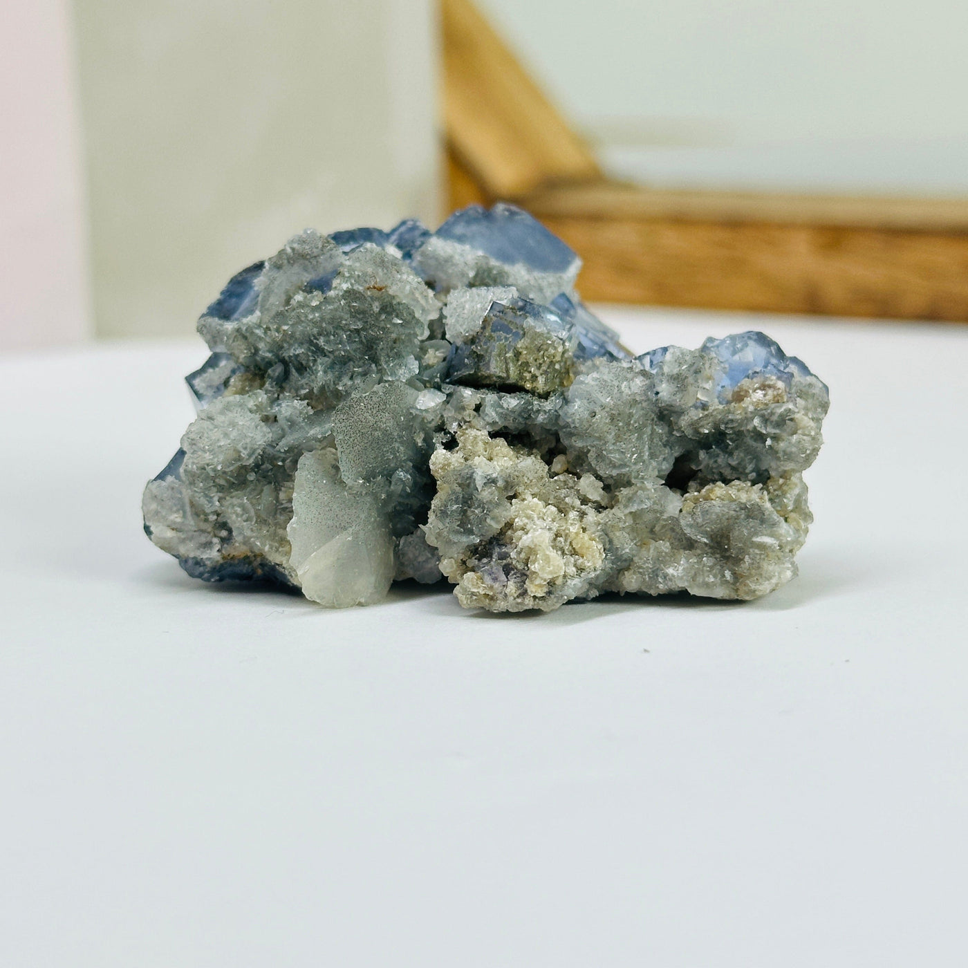 blue fluorite with decorations in the background