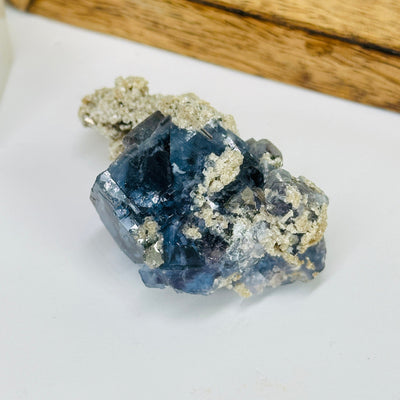 blue fluorite with decorations in the background