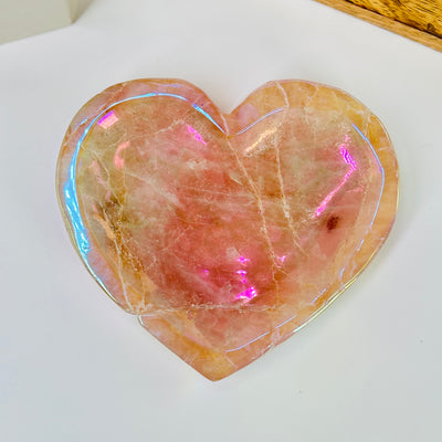 rose quartz bowl with decorations in the background