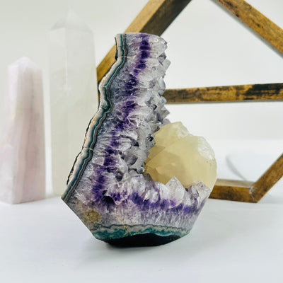 amethyst cut base with decorations in the background