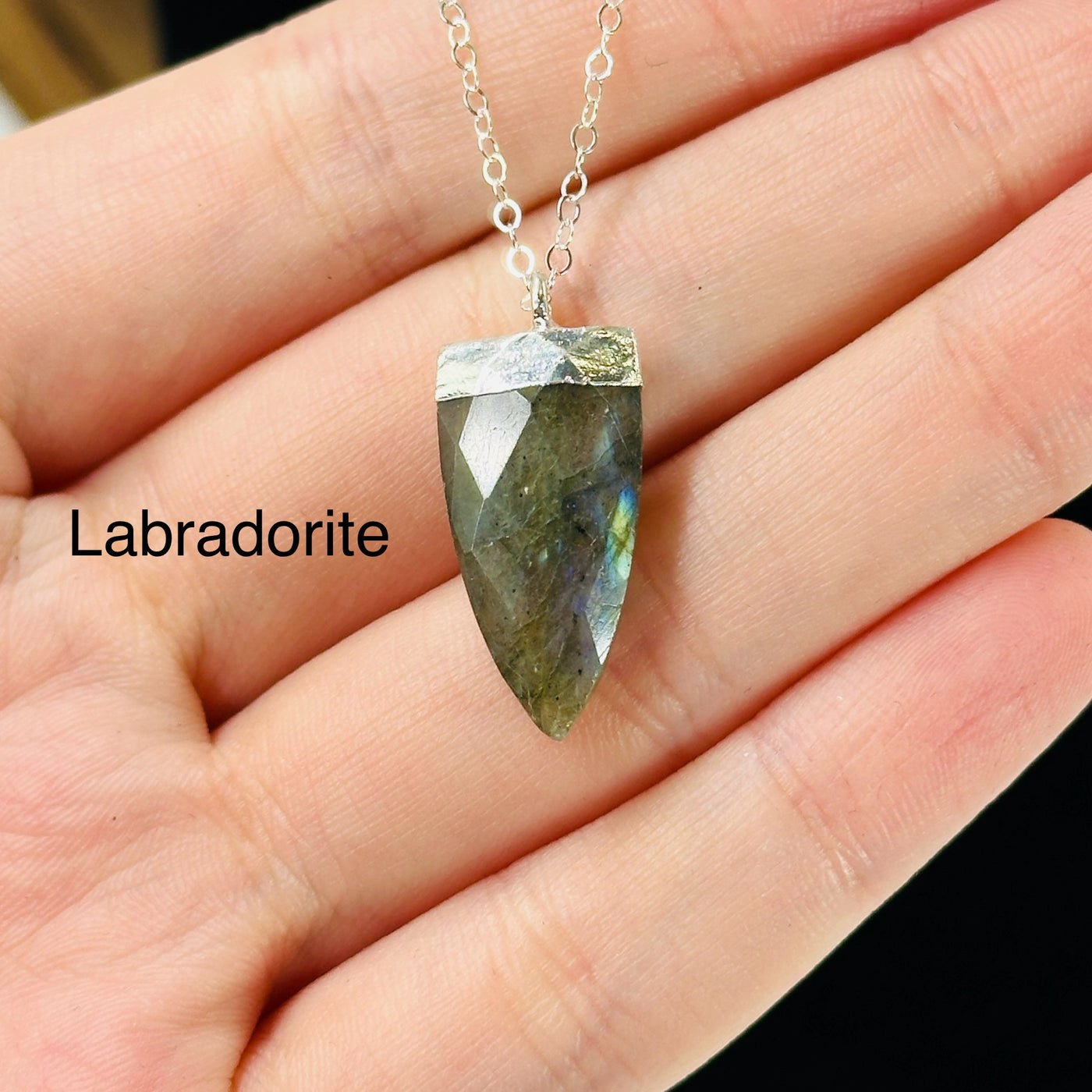 gemstone necklaces with decorations in the background