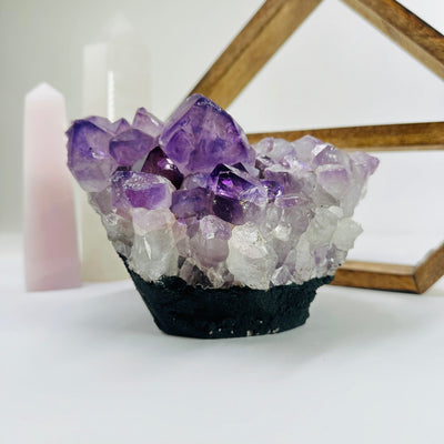 amethyst cut base with decorations in the background