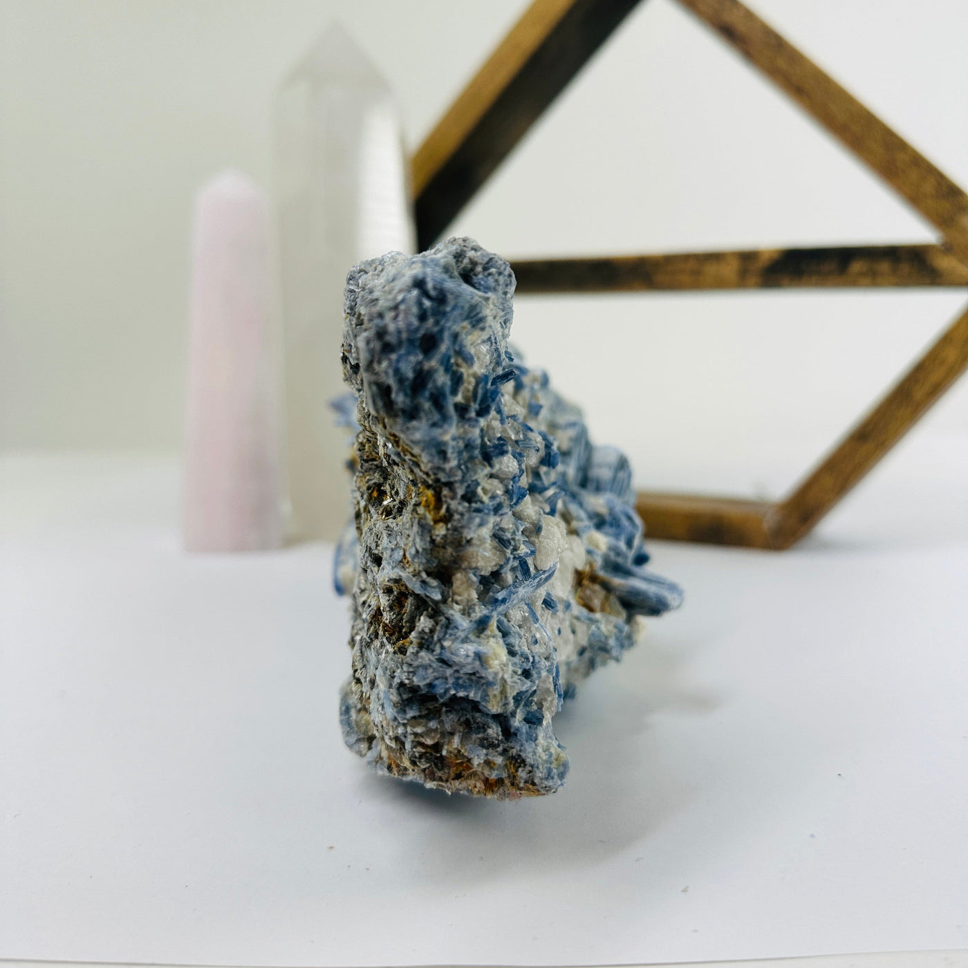 kyanite with decorations in the background