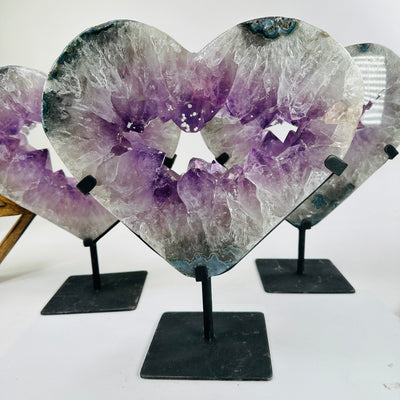 amethyst hearts on stand with decorations in the background