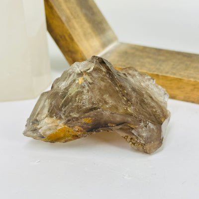 smokey quartz with decorations in the background