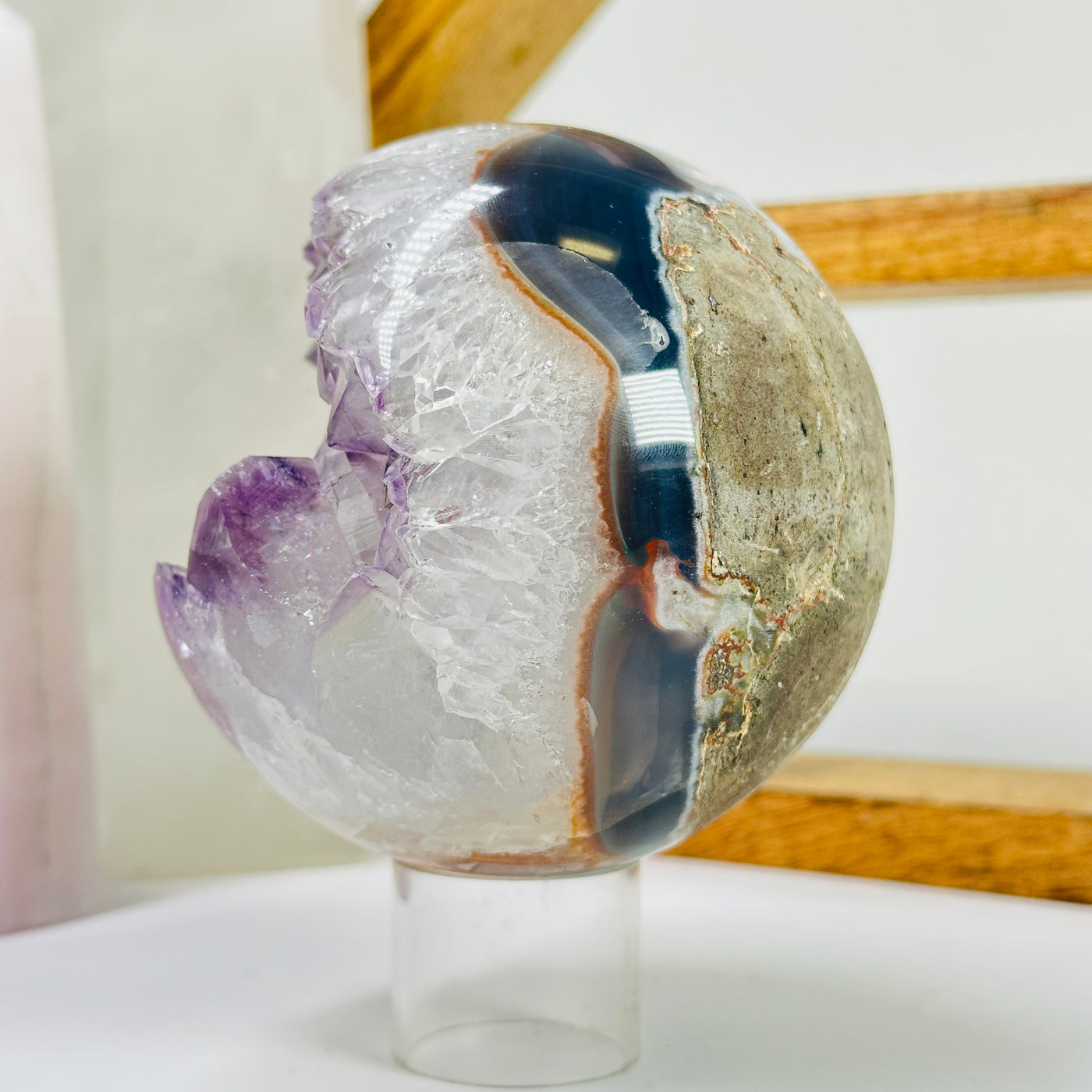 amethyst sphere with decorations in the background