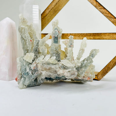 apophyllite with decorations in the background