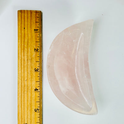 rose quartz bowl next to a ruler for size reference