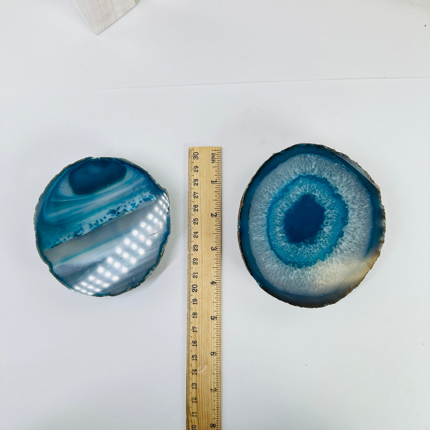 teal agate coaster next to a a ruler for size reference