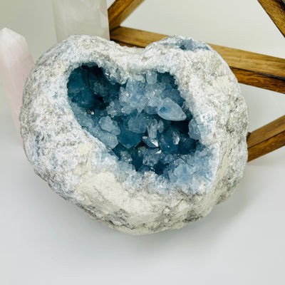 Celestite with decorations in the background