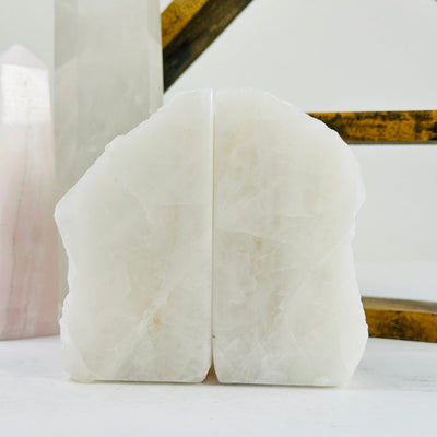 crystal quartz bookends with decorations in the background