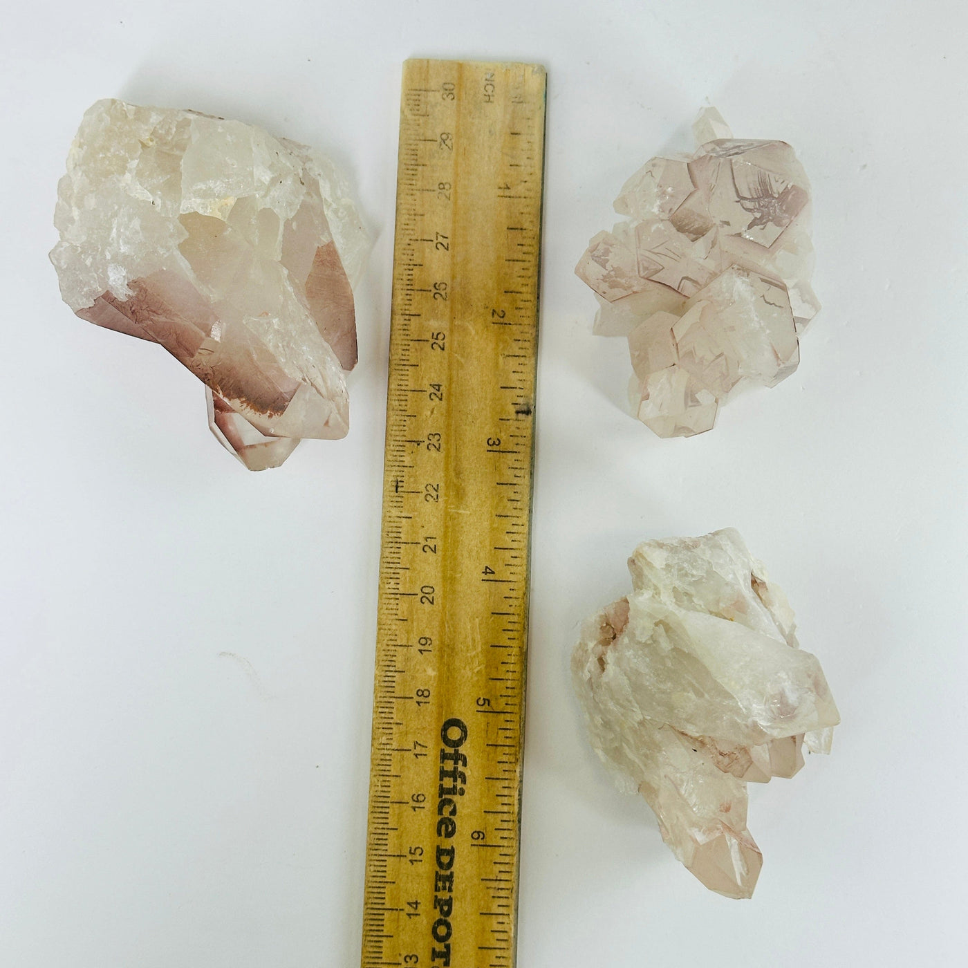 lithium quartz next to a ruler for size reference