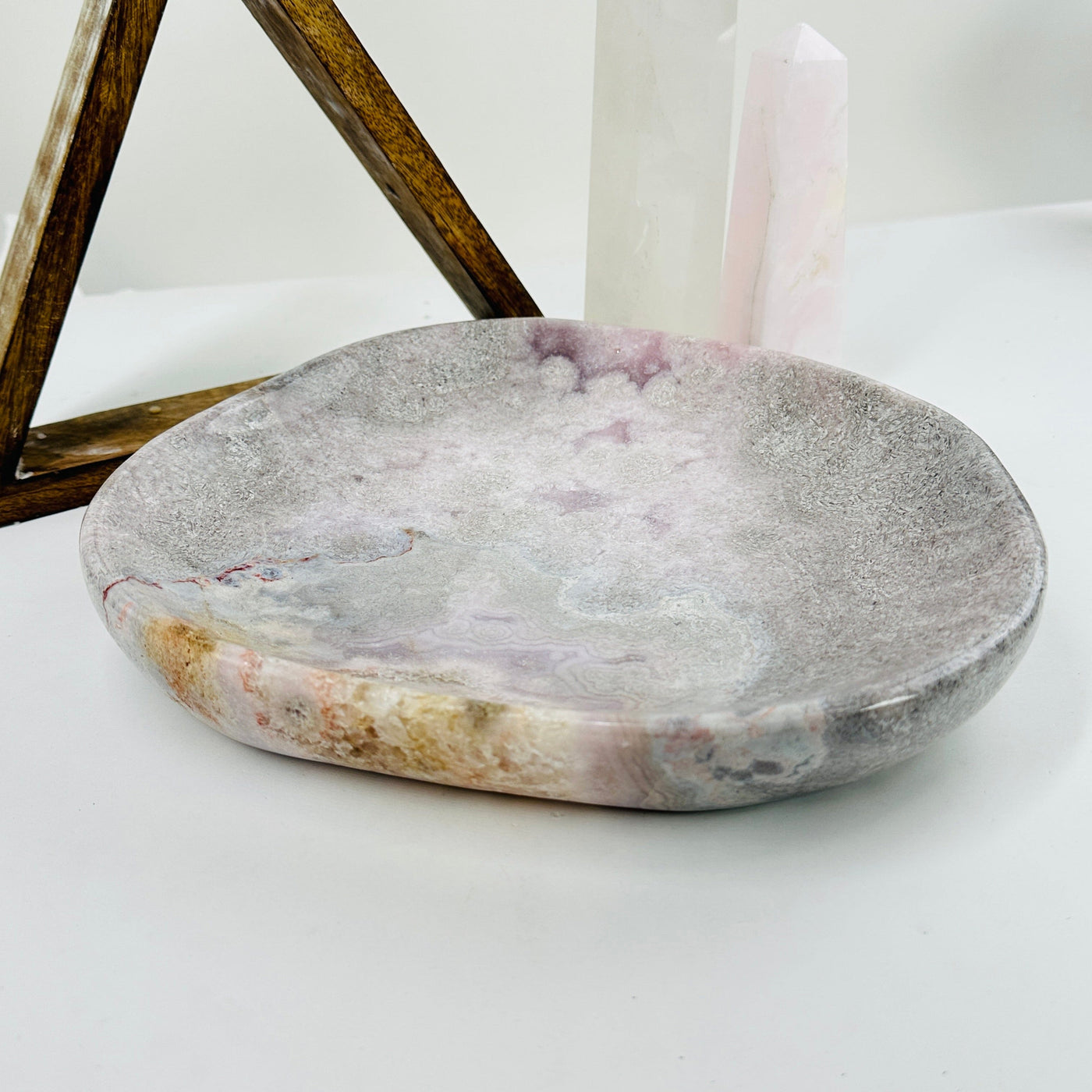 pink amethyst plate with decorations in the background