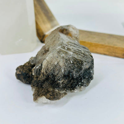 rutile quartz with decorations in the background