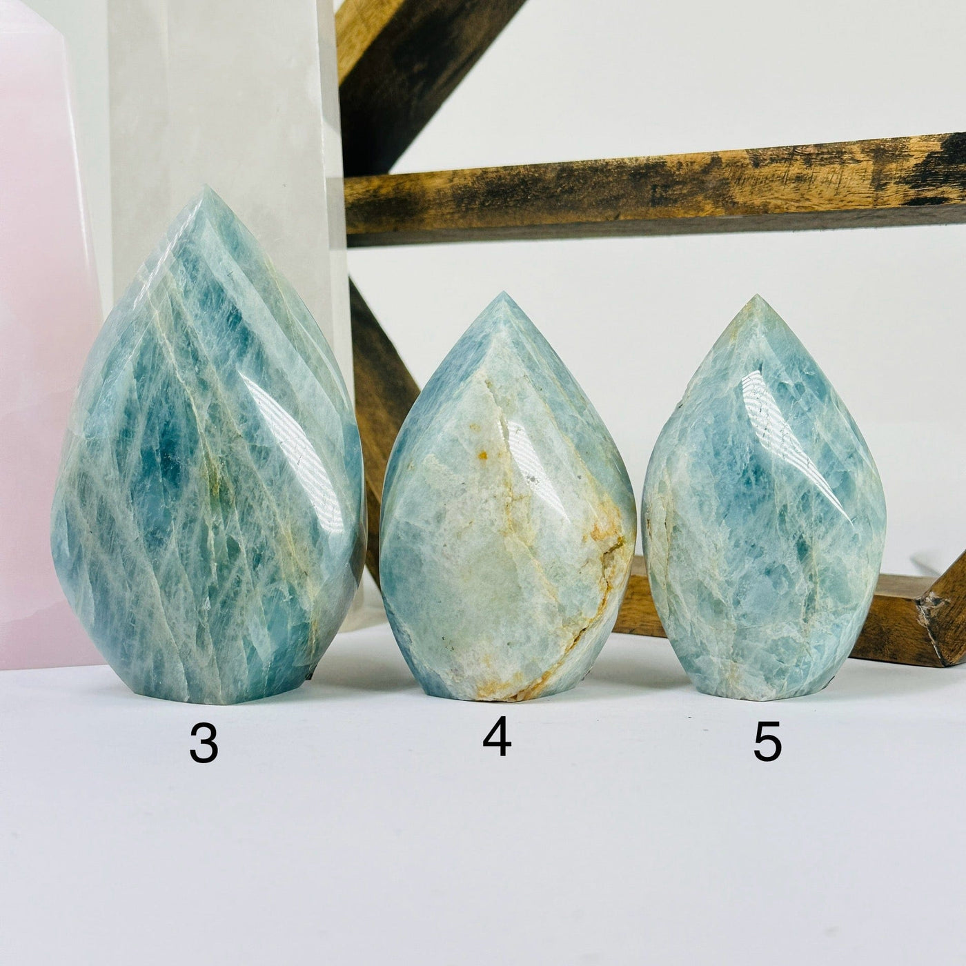 aquamarine points with decorations in the background