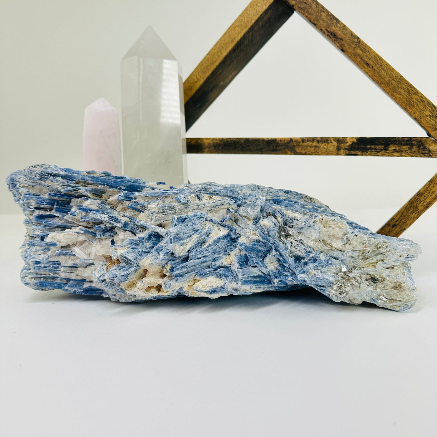 kyanite with decorations in the background