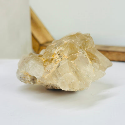 citrine cluster with decorations in the background