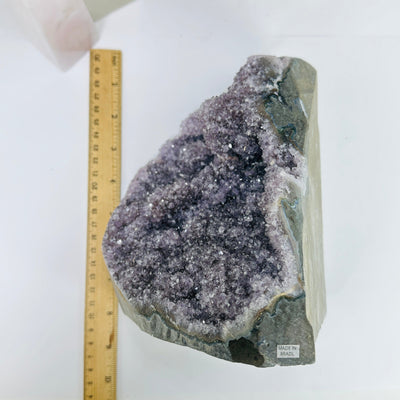 amethyst cut base with decorations in the background