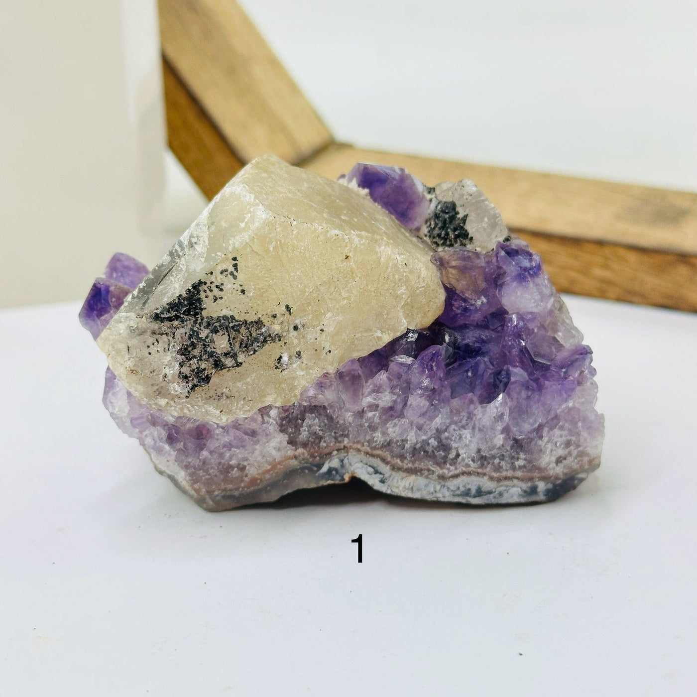 amethyst cluster with decorations in the background