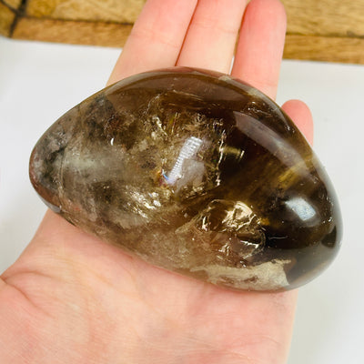 smokey quartz with decorations in the background