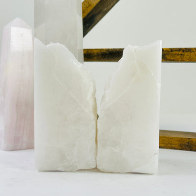 crystal quartz bookends with decorations in the background